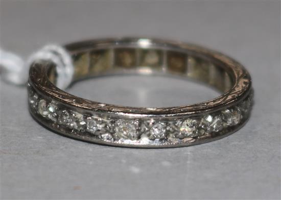 A platinum and diamond full eternity ring, size N.